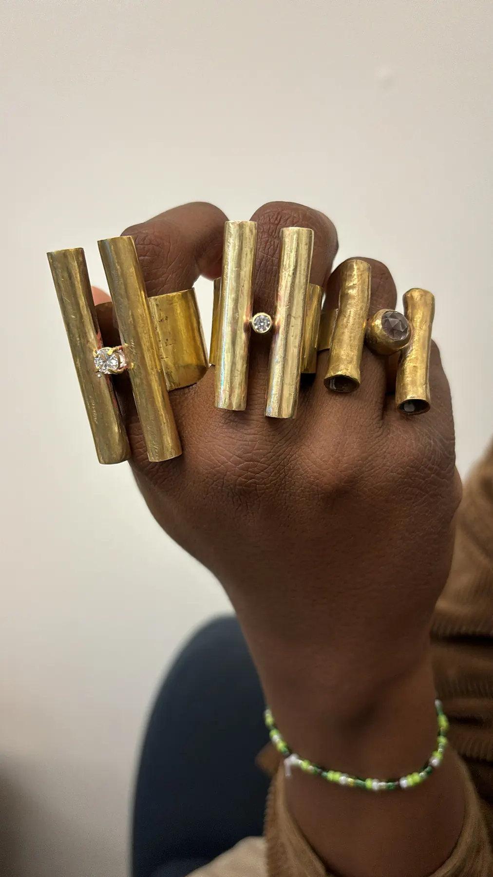 Sage Wearing Brass Rings