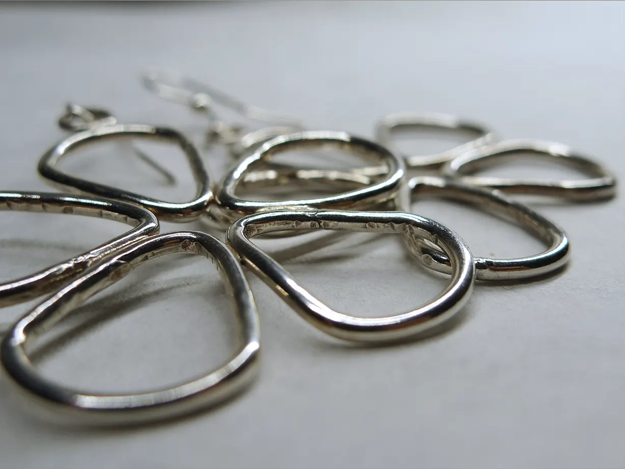 Sculptural silver flower jewelry